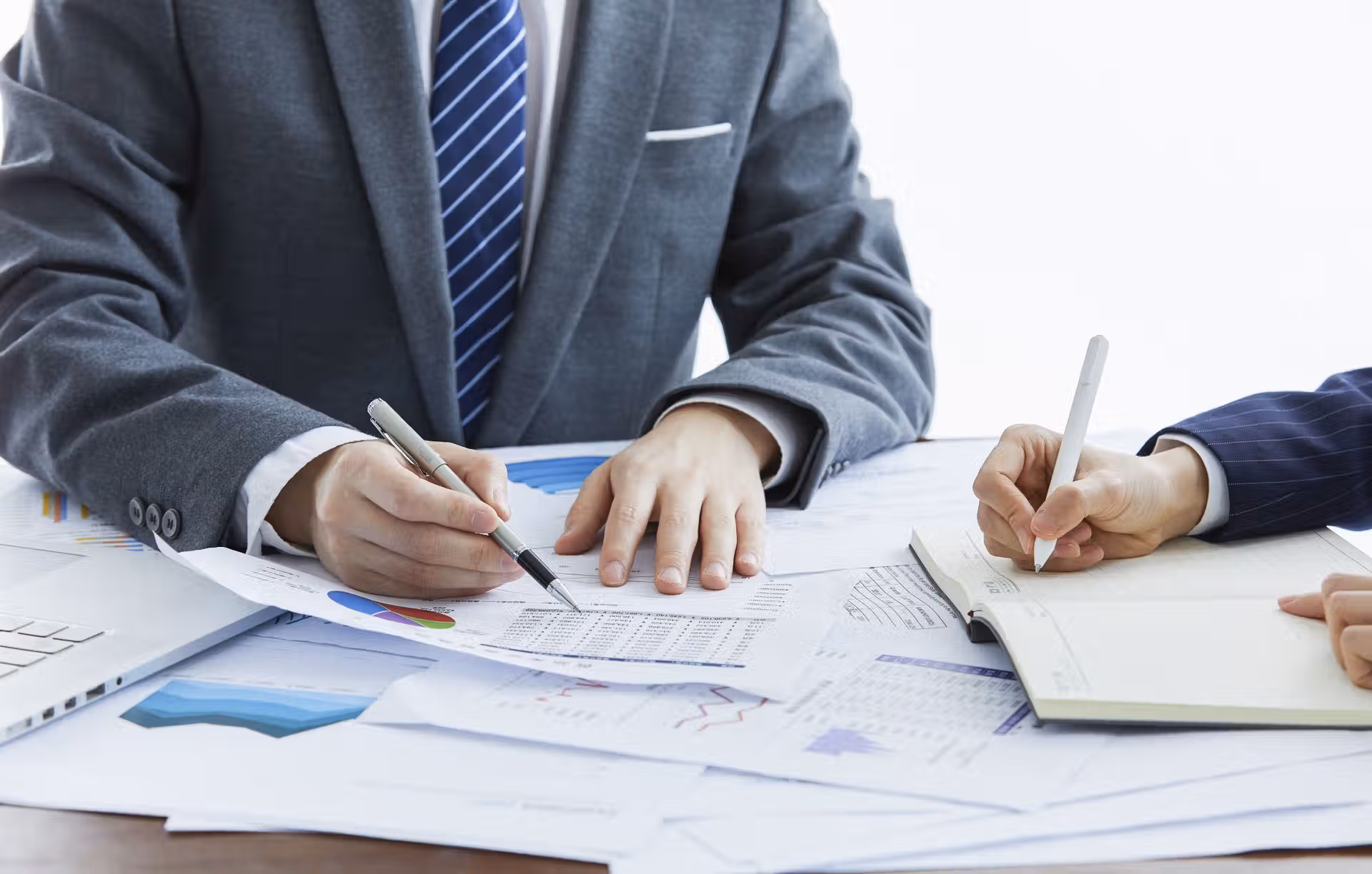 businessmen-in-elegant-suits-at-a-business-meeting-2023-11-27-04-53-32-utc.jpg
